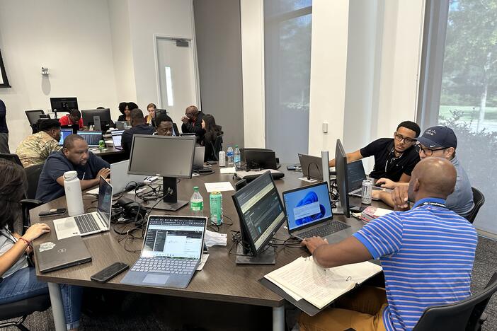 Cyber Dawg event participants working